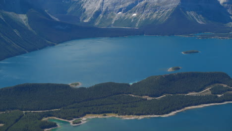 A-thrilling-helicopter-tour-of-the-Canadian-Rocky-Mountains,-breathtaking-aerial-views-of-snow-capped-peaks,-glaciers,-rivers,-and-forests