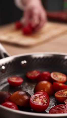 preparing sliced tomatoes in a pan