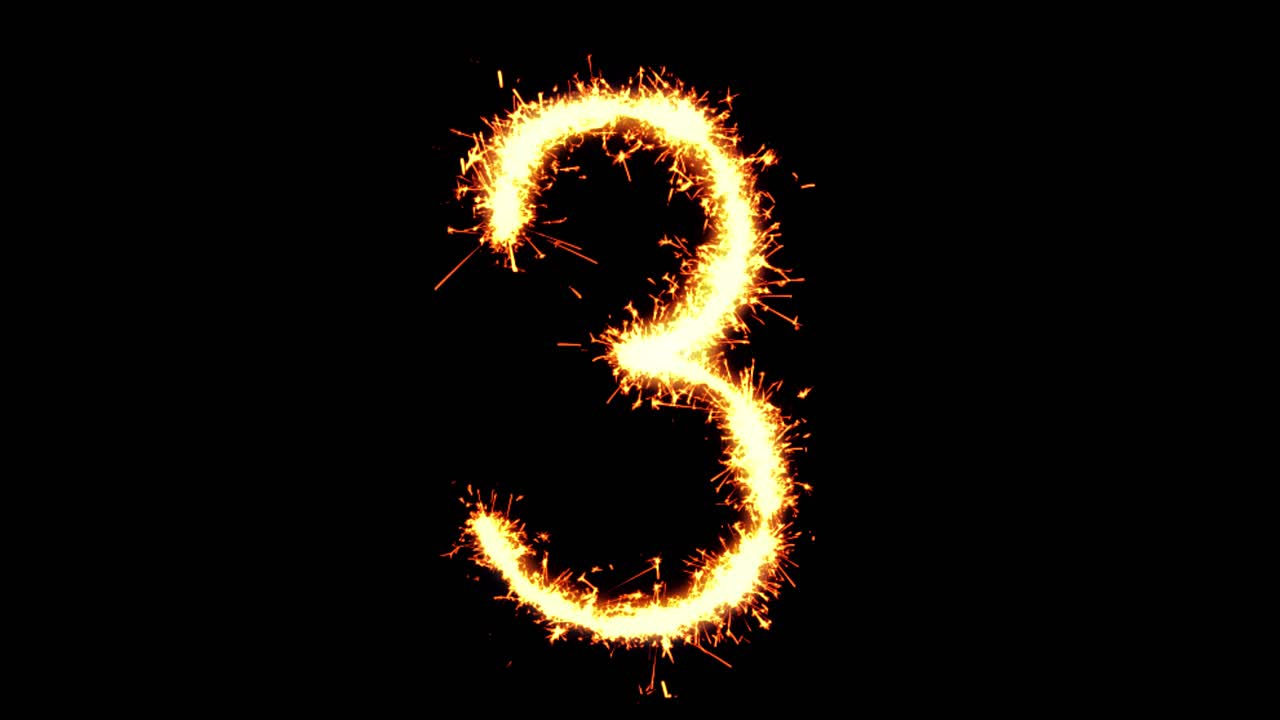 Numero 3 scritto con scintille luminose, particelle glitterate e fuochi d'artificio su sfondo nero in loop 4K.