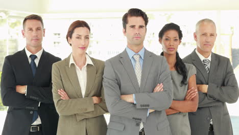 Serious-business-people-looking-at-camera-with-arms-crossed