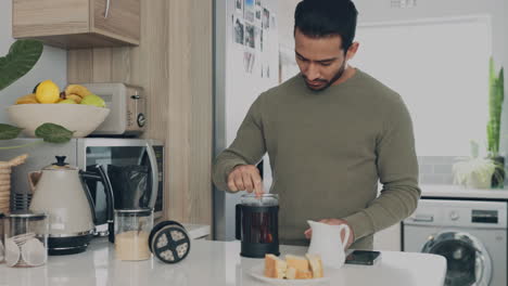 man making coffee in the kitchen