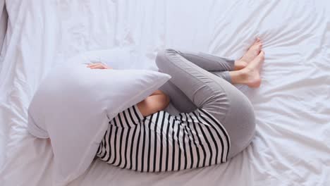 sick young woman on bed concept of stomach ache headache insomnia or anxiety sick young woman on bed concept of stomach ache headache insomnia or anxiety video