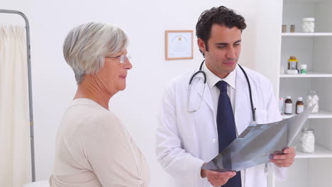 Doctor-holding-a-chest-xray-and-gives-a-handshake-to-a-patient