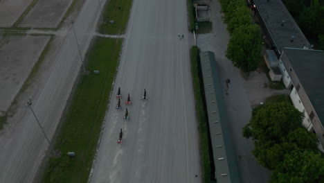 Horse-Race-with-Harness-Racers-on-dirt-track,-Aerial-Birds-Eye-Overhead-Top-Down-View