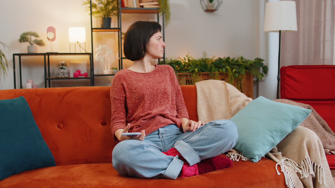 Upset displeased woman using smartphone surprised by lottery results or bad news loses fail game