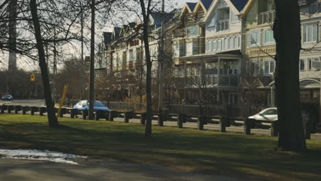 vehicles traveling across road along with beautiful structures during daytime