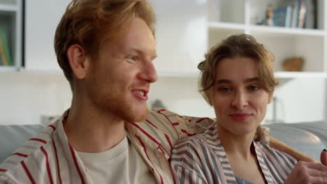 young lovers talking home in pajamas closeup. happy people enjoy serene morning