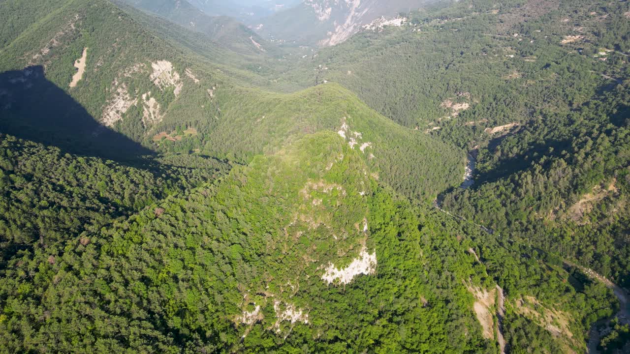 Bird’s-eye view of breathtaking landscapes, with French mountains and untouched forests glowing in the sunlight.