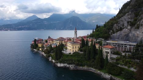 static wide angle drone shot of varenna old historic town on lake como