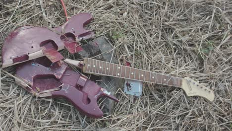 broken red electric guitar