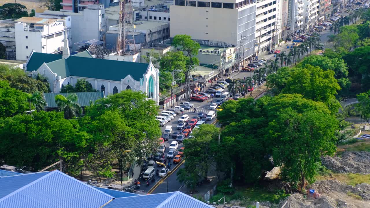 Aerial view of busy traffic stopped at road junction in capital city of Manila Philippines