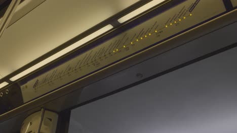traveling on the paris subway, a close-up shot of the route indicator with glowing lights