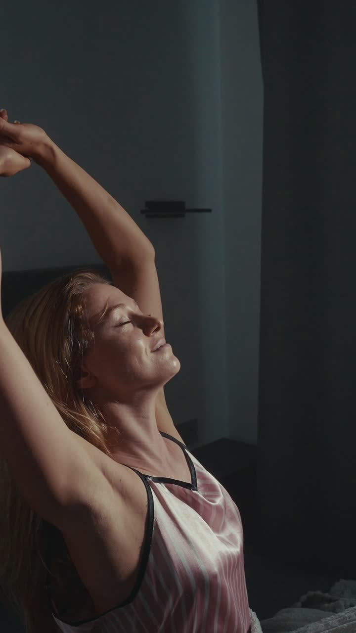 Woman Stretching in Pajamas