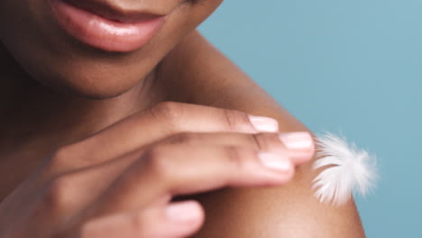 Skincare,-feather-and-black-woman-at-beauty