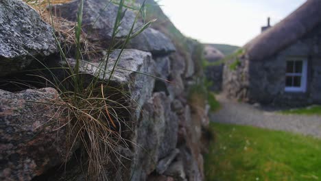 Shot-of-the-stone-masonry-and-thatched-roof-on-a-blackhouse