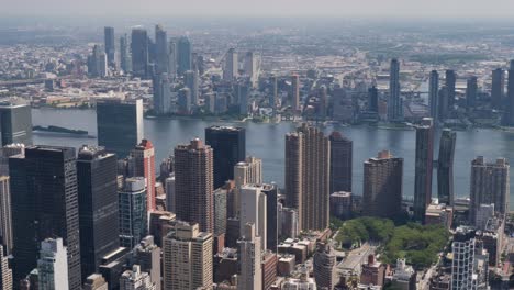 slow motion landscape of business towers buildings skyscrapers cbd urban skyline of manhattan new york city hudson river usa america travel tourism infrastructure