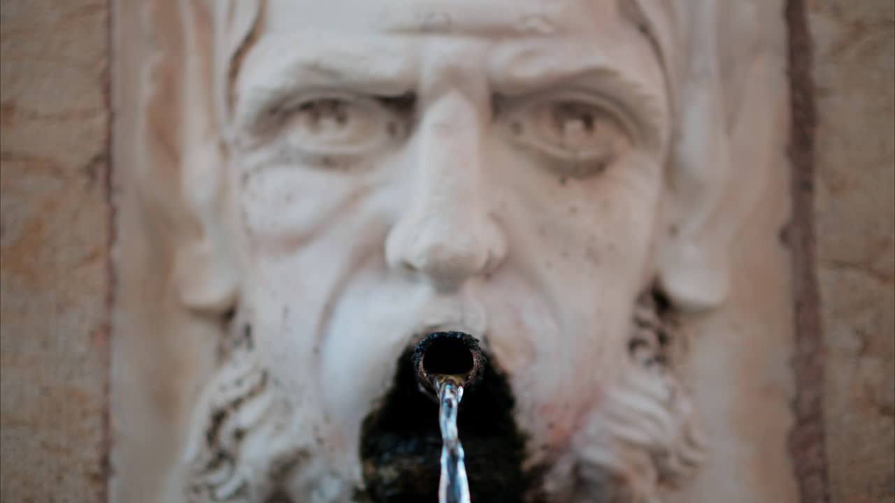 Antibes, France - October 1, 2024: Close up of water pouring from the Fountain d'Aguillon