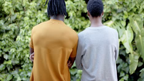 African-american-woman-in-grey-sweatshirt-and-man-in-yellow-t-shirt,-slow-motion,-copy-space