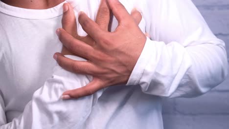 man experiencing chest pain