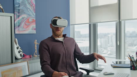 Amazed man exploring 3d game office closeup. Freelancer watching virtual movie