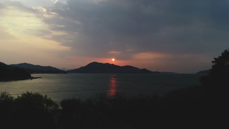drone reveal shot of sunrise in hong kong