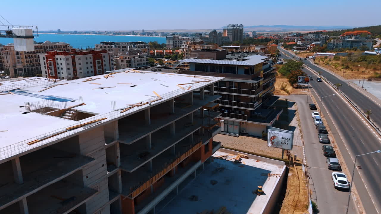 Varna, Bulgaria, 11 July 2025: Commercial roof build. Construction workers are installing a flat roof on a commercial building in Turkey during sunny weather