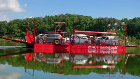 Close-up-shot-of-cargo-boat-sailing-with-car-in-the-river