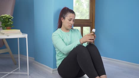 Suicide-woman-leaning-against-the-wall.