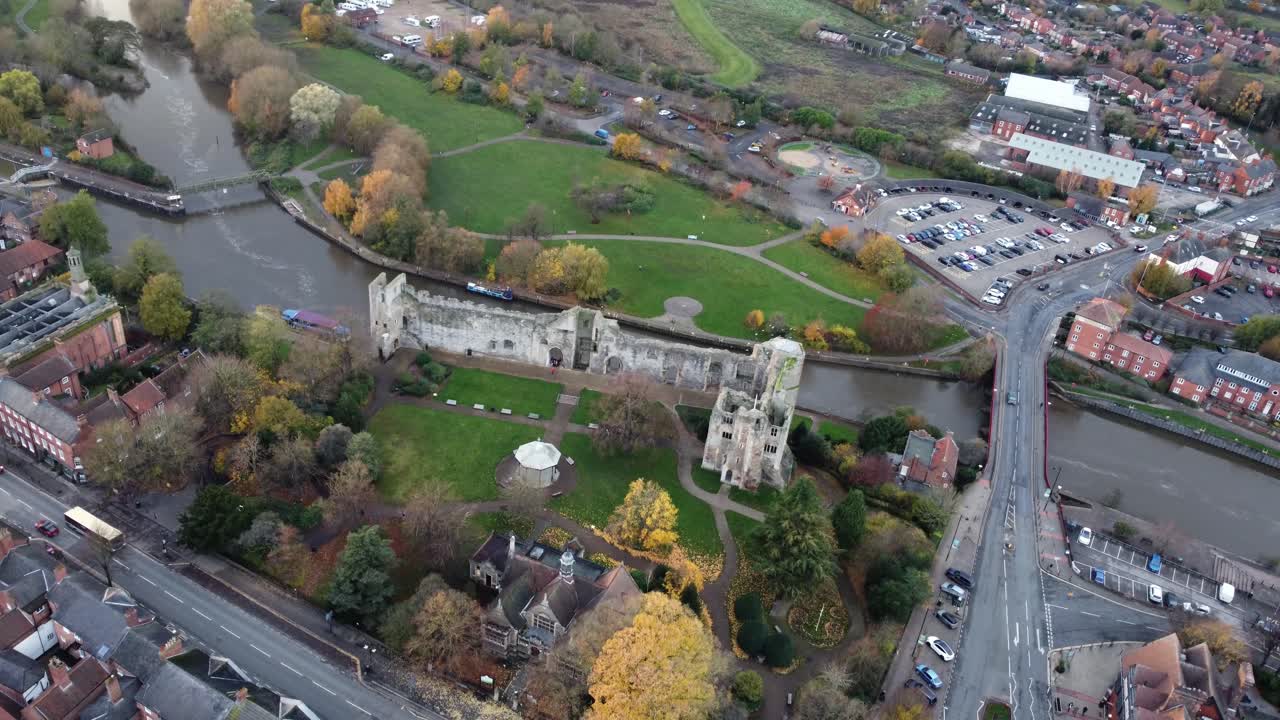 Aerial view of a castle ruins by the river