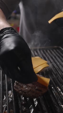 chef cooking a burger on a grill