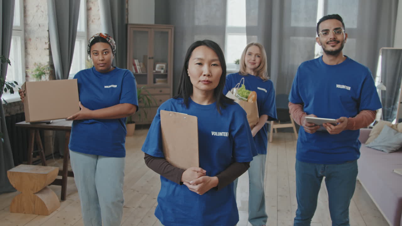 Multi-Ethnic Team of Volunteers in Blue T-Shirts