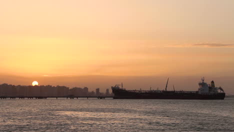 brazil`s golden hour by the sea with boat and magical colors