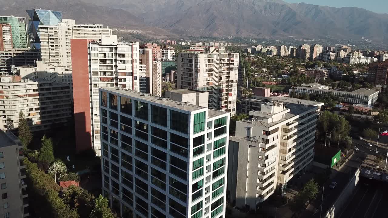 Aerial View of Santiago de Chile Residental Suburbia Under Andes Mountain Range on Sunny Evening