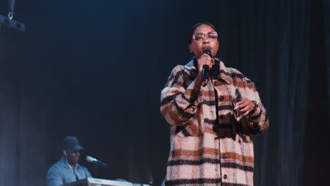 woman giving a speech on stage