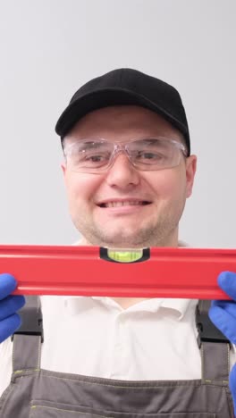 man with water building level construction tool equipment repair