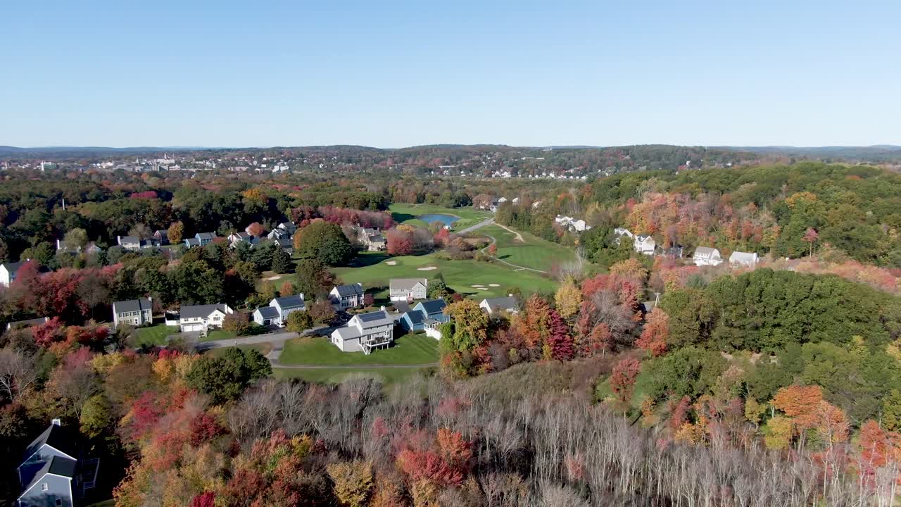 Beautiful town of Haverhill with beautiful autumn colors, aerial drone fly forward view