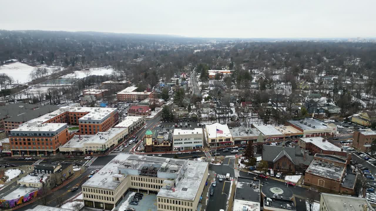 Aerial drone footage of South Jersey in winter, featuring snow-covered rooftops, streets, and urban areas. Capturing the cold season’s atmospherphere