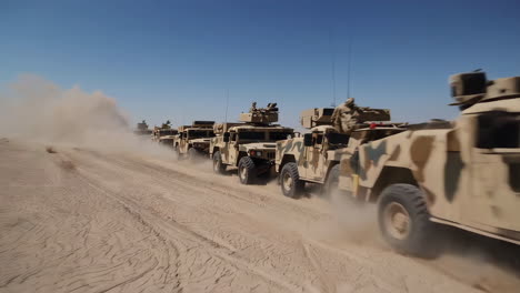 military convoy in desert terrain