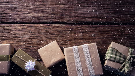 falling snow with christmas gifts decoration on wood