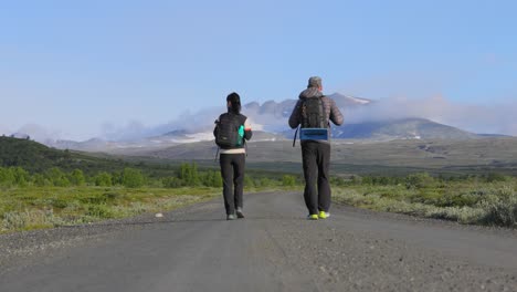 hikers on a mountain road