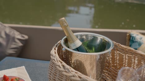 Bottle-of-champagne-in-bucket-on-canal-boat