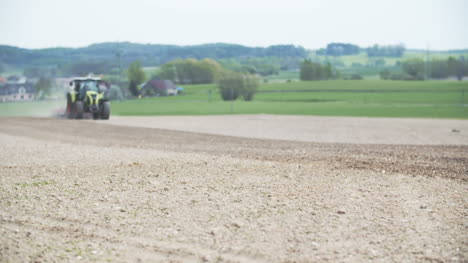 agriculture wide shoot of agricultural tractor sowing and cultivating field