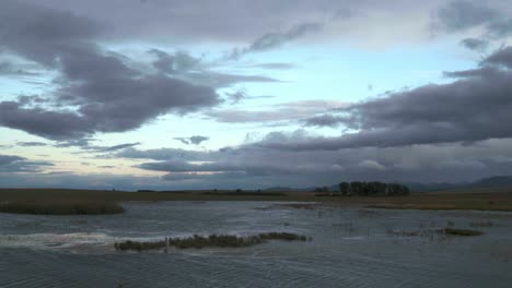 stormy sunset over a tranquil lake