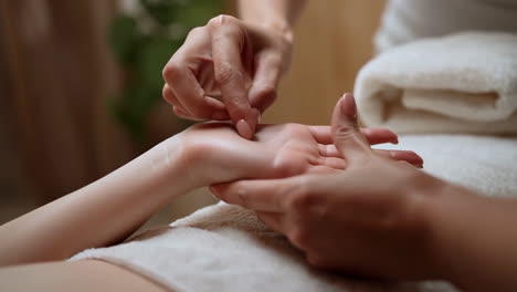 Close-up of a hand receiving a treatment or massage