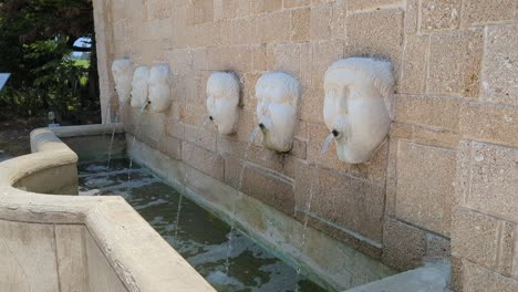 face fountains in st augustine, fl. a set of masks that decorate this fountain was a gift to the city of st. augustine by its sister city in spain, the city of avilés, birthplace of pedro menéndez.