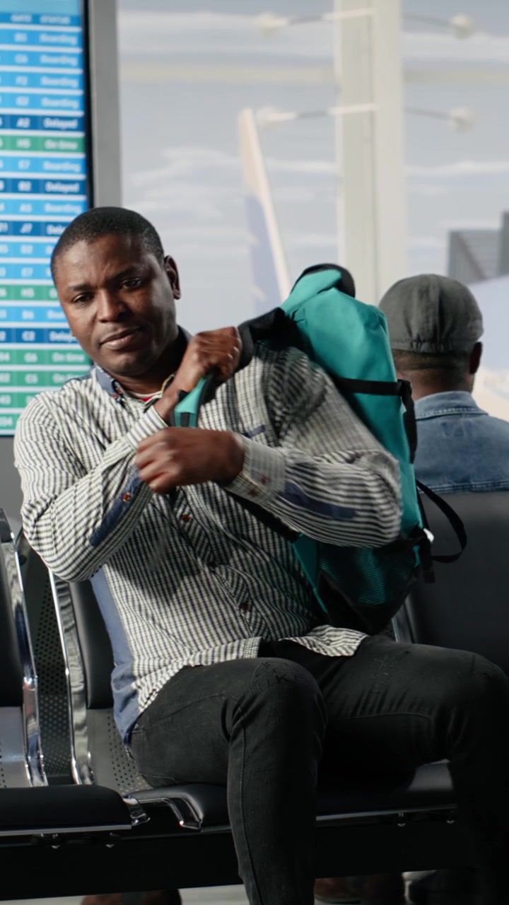 Diverse Travelers Waiting for Flight in Airport Departure Lounge