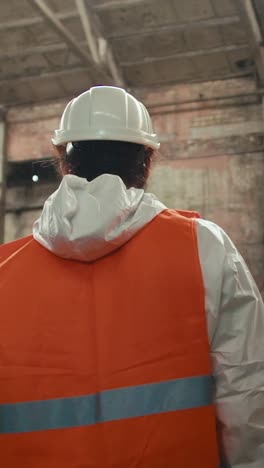 worker in protective gear in an industrial setting