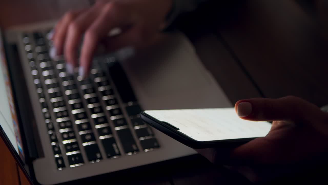 Working Late at Night on Laptop and Smartphone