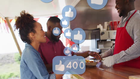 social media likes animation over people ordering food at outdoor stand