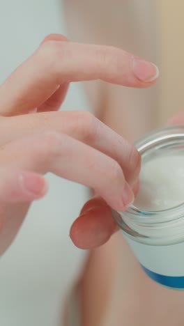 woman applying face cream